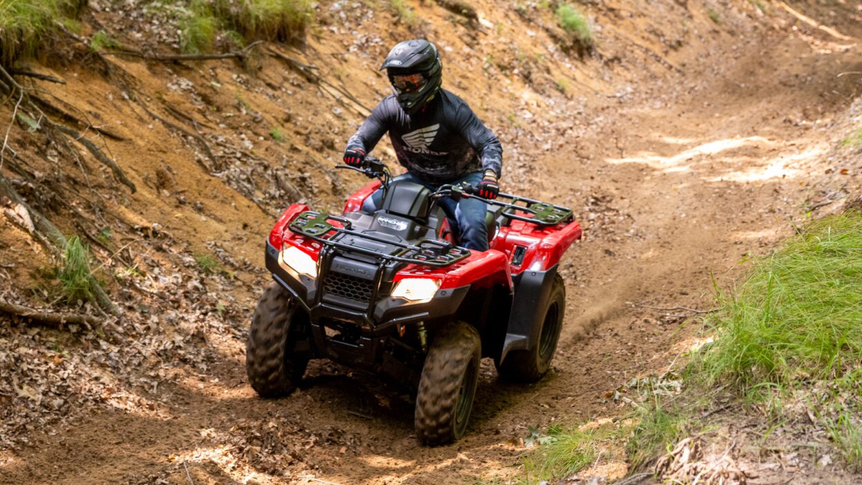 Driver on Rancher, going left on dirt road.