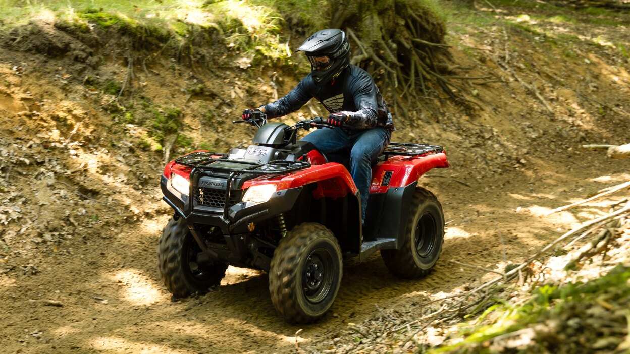 Driver on Rancher, going left on dirt road.