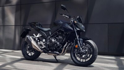 CB500F stationary in grey concrete landscape.