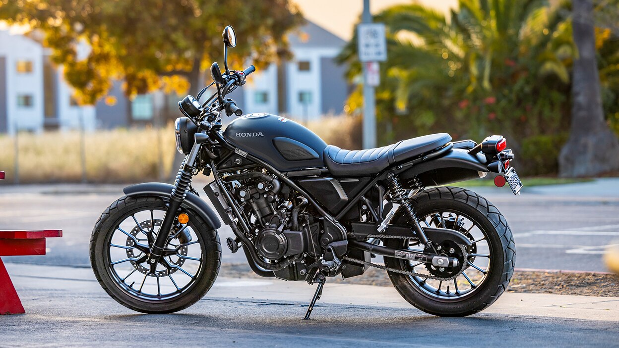 Left angle of SCL500 in street. Stationary. Trees in background.