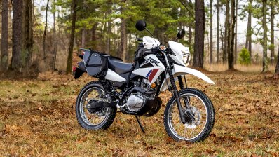 XR150L on stand in forest.