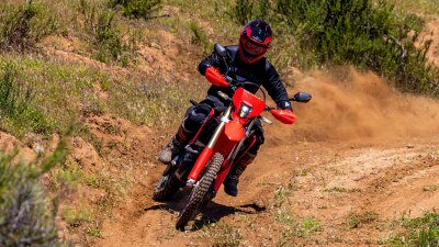 Rider on CRF450L head on view on dirt track.