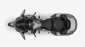 Top-down overhead view of a black touring motorcycle.