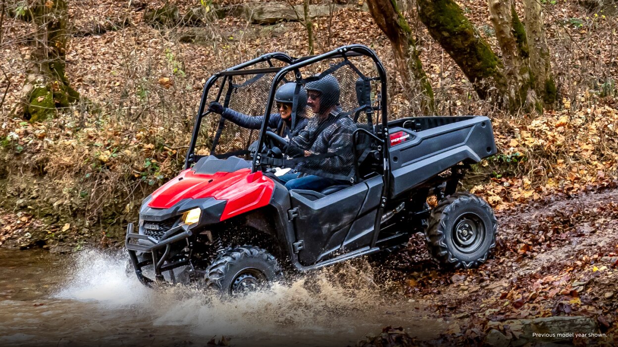 Lifestyle. Driver and passenger going left into water on slight decline.