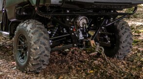 Close-up of the rear wheel, tire, and suspension of a Honda Pioneer 700.